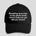 Standing Up As Soon As The Plane Lands Won’t Help You Get Off Any Sooner Hat