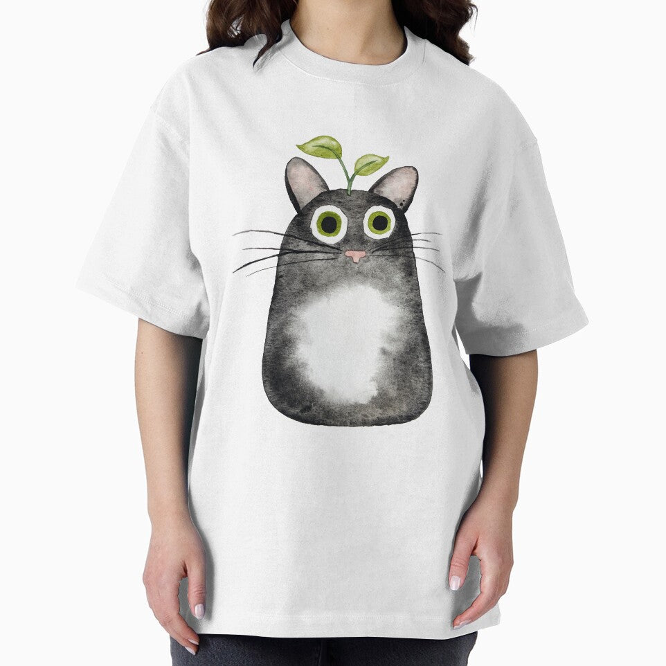 Black Tuxedo Cat with Plant by Hannah Smolensky