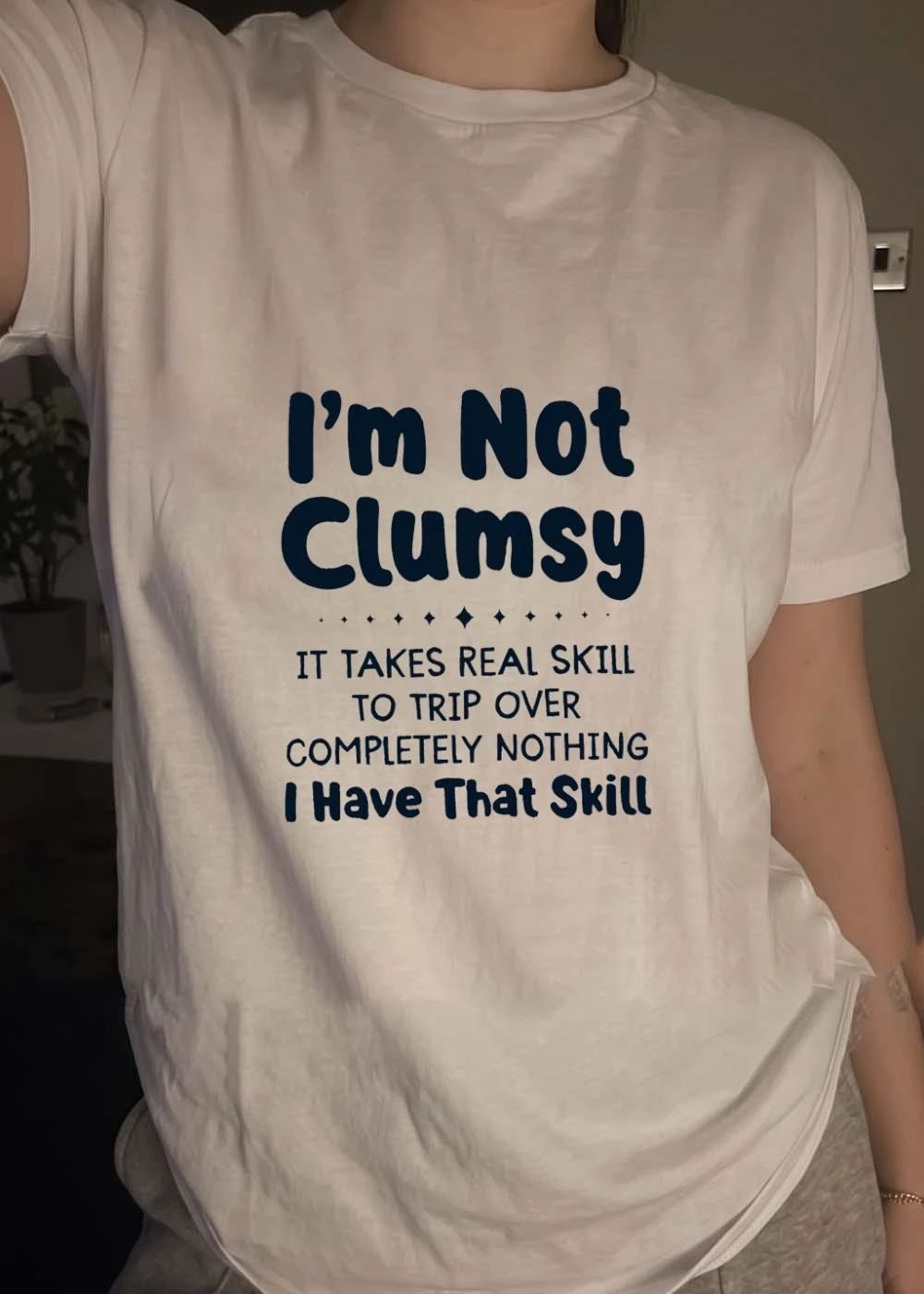 Funny Apparel Quote I’m Not Clumsy It Takes Real Skill To Trip Over Nothing T-Shirt