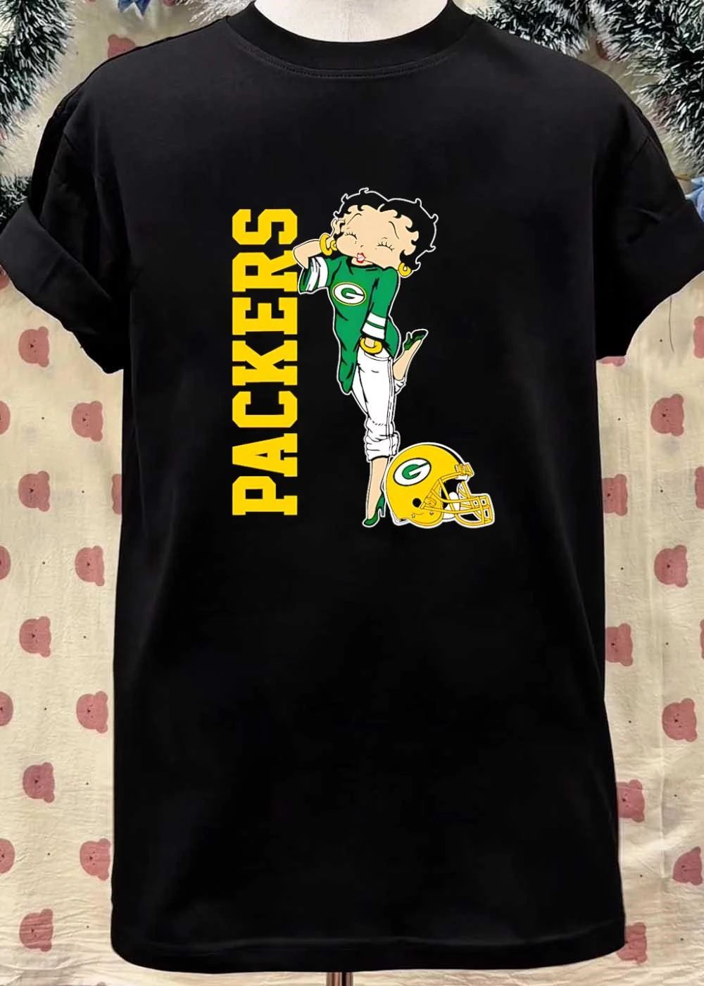 Betty Winking and Leaning on Helmet Packers shirt