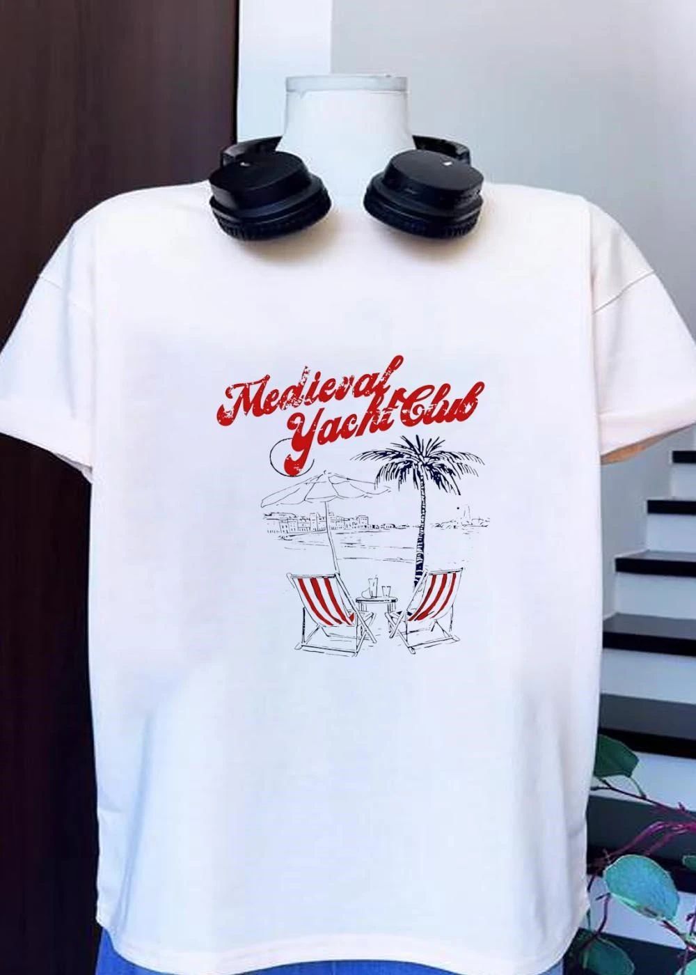 Relaxing Beachfront Oasis with Striped Lounge Chairs and a Palm Tree Medieval Yacht Club T-Shirt